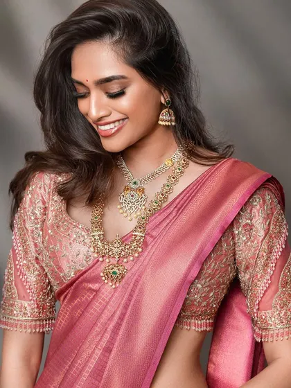 A candid-style bridal shot that captures a moment of joy. This approach brings a natural and relatable feel to bridal lookbooks, highlighting the beauty of the attire in a more personal way.