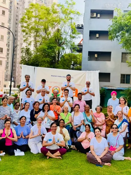 A group photo with participants from the International Yoga Day event. It's a joy to see so many smiling faces after a session dedicated to wellness and shared practice.