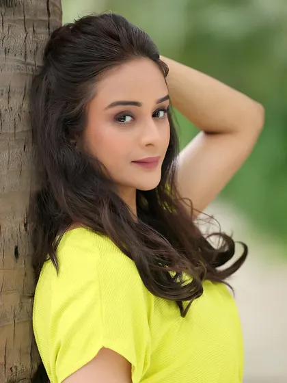 A fresh and natural outdoor portrait of actress Harleen Kaur. This kind of shot is perfect for demonstrating a grounded, girl-next-door appeal.
