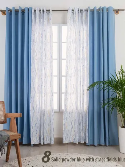 This combination of solid powder blue curtains with the Grass Fields Blue sheer is perfect for a calm and cool-toned room. The pairing provides both privacy and a gentle, filtered light, creating a tranquil retreat.