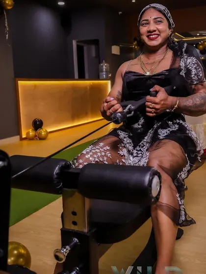 Even at a gym opening, I can't resist a quick set. Here I am on the seated row machine, demonstrating my love for the grind no matter the occasion.
