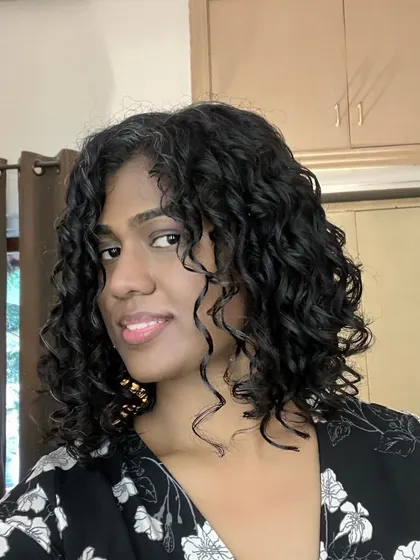 Monisha looking fantastic with her new, shorter curly hair.