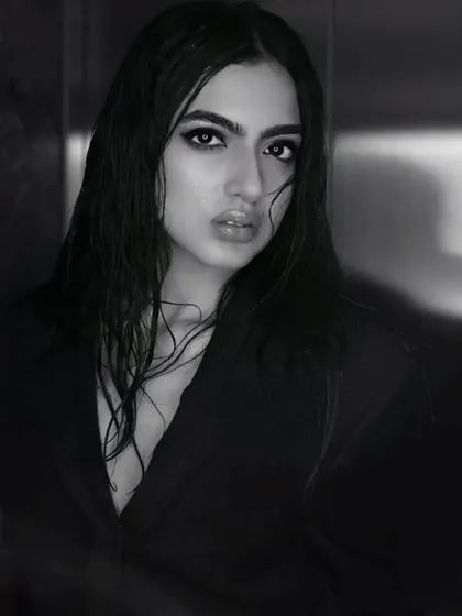 A full-frame shot showing the blazer styling with the wet hair and makeup. This demonstrates my ability to collaborate with stylists to create a complete and cohesive editorial vision.