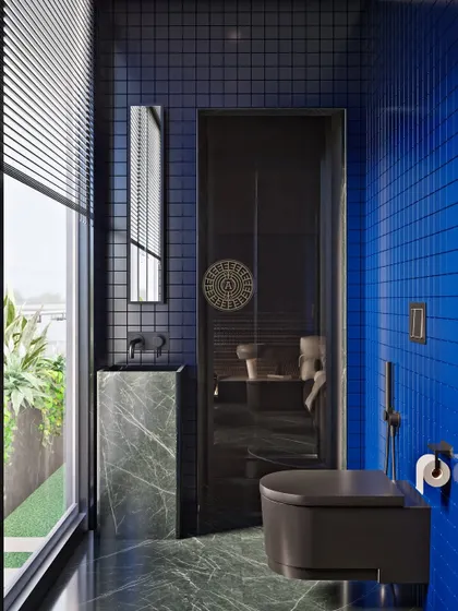 A render for a guest bathroom in a Kolkata home, featuring bold cobalt blue tiles, dark green marble floors, and matte black fixtures for a modern and impactful look.