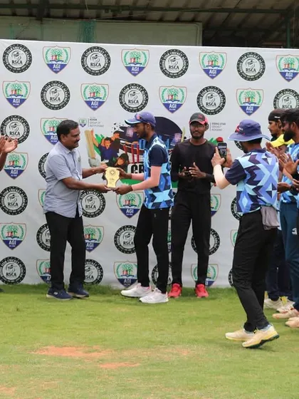 The winning team receives their trophy, surrounded by applauding teammates, marking a successful conclusion to their tournament match.