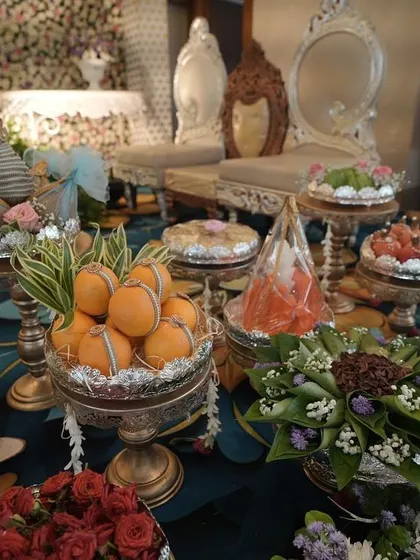 An assortment of beautifully arranged gift and sweet trays, adding to the festive and abundant feel of the celebration.