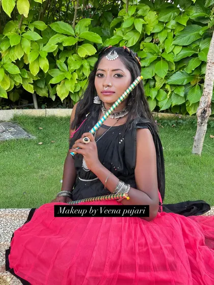 Getting into the Navratri spirit with a Dandiya look. The oxidized jewelry and colorful dandiya sticks complete the festive vibe.