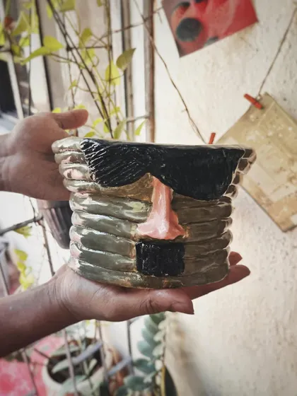 This student started with a one-time workshop and came back to begin his pottery journey. His pieces, like the quirky radio and the massive planter, are full of fun and character.
