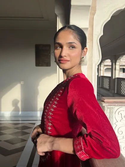 A stunning shot of model Kashish Kapoor for the House of Pataudi campaign. The makeup is clean and elegant, with a focus on flawless skin to complement the rich velvet texture of the outfit.