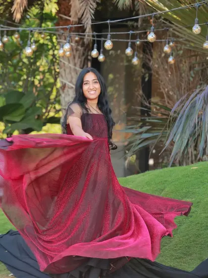 The way this maroon shimmer gown flows and catches the light makes it a fantastic choice for creating dynamic and joyful maternity photos.