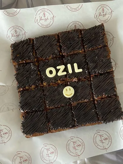 A custom brownie slab with a personalized message. These are great for birthdays or as a fun alternative to a traditional cake.