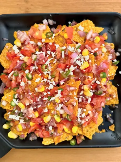 Our Loaded Nachos are perfect for sharing with friends while you relax and watch the pups have fun.