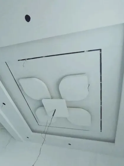 A floral-inspired design within a square frame, constructed from gypsum board and ready for the next stage of finishing.