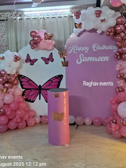 Another angle of the pink butterfly themed birthday party for Samreen. This view shows the detailed balloon work and the placement of the butterfly cutouts.