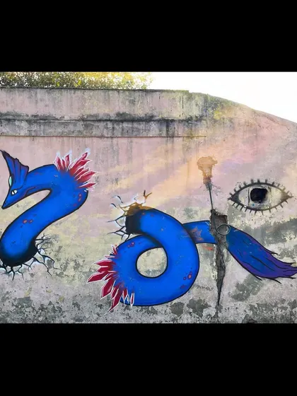 The full wall from the Khan Market jam, showing my sea monster character alongside another artist's piece.