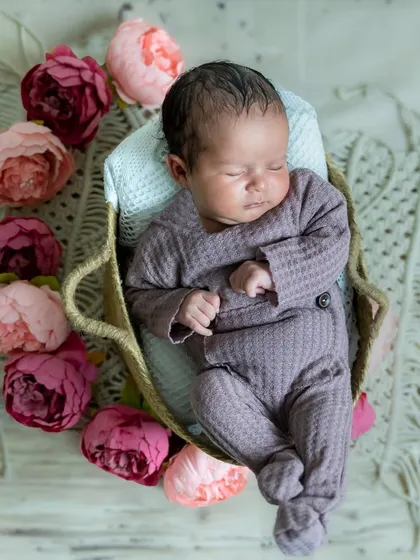 So peaceful and serene. This overhead shot of a sleeping newborn surrounded by flowers is a beautiful way to remember how small they once were.