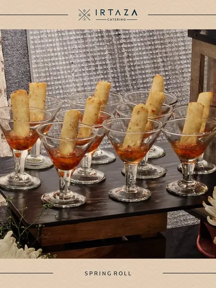 Spring Rolls served in martini glasses with a dipping sauce. This is another example of my stylish and practical presentation for classic appetizers.