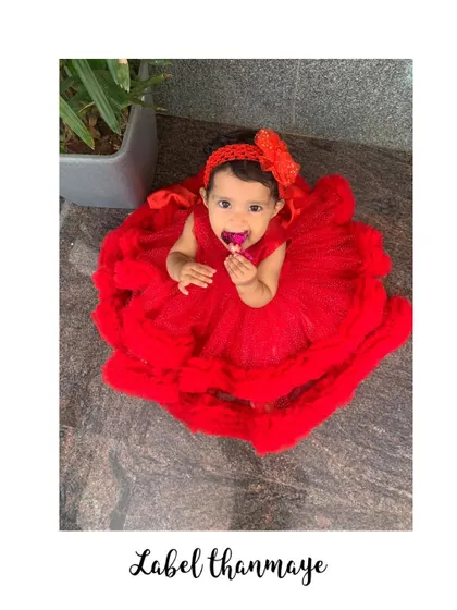 An aerial view of the red birthday frock, showing how full and fluffy the skirt is.