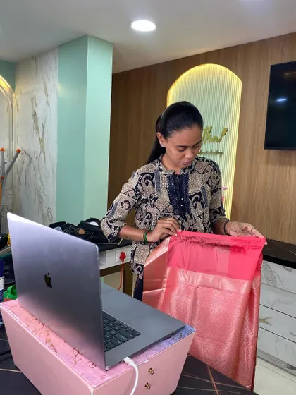 Our trainer conducts a saree draping class online, showing students how to perfect their technique from anywhere.