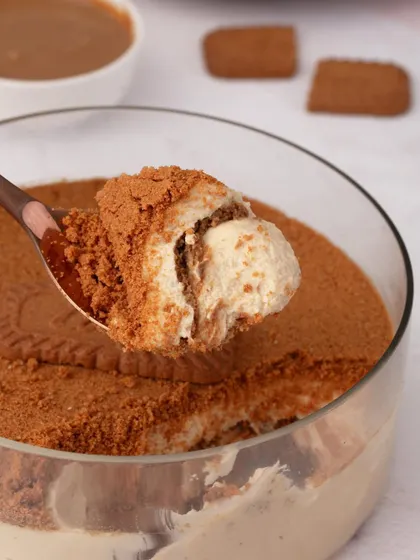 A close-up spoonful of our Biscoff Tiramisu, showing the creamy texture and layers within. It’s the perfect blend of irresistible Biscoff, mascarpone, and rich coffee.