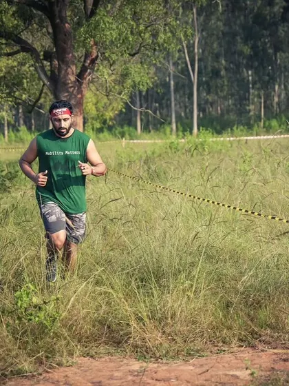 Running through the tall grass on the Spartan course. These races take you through all kinds of challenging terrain.