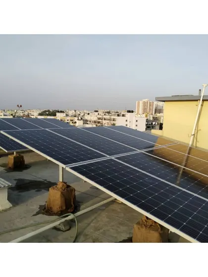 Another beautiful view of the Bangalore skyline, featuring a newly installed array of solar panels. Our systems are designed to maximize sun exposure and energy generation.