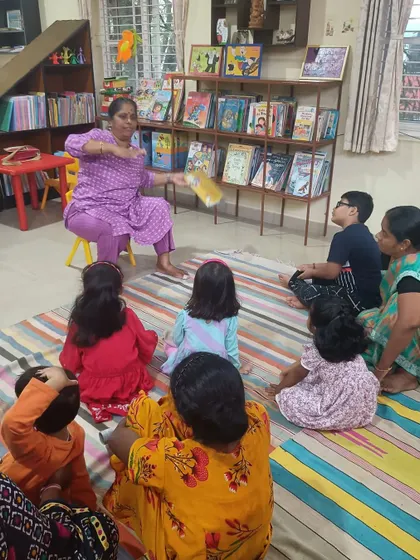 Using hand gestures, the storyteller adds drama and excitement to the narrative.