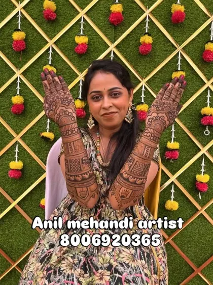 A beautiful client proudly showing her full-arm mehendi. Her smile says it all. I work to make sure every bride feels this happy with her design.