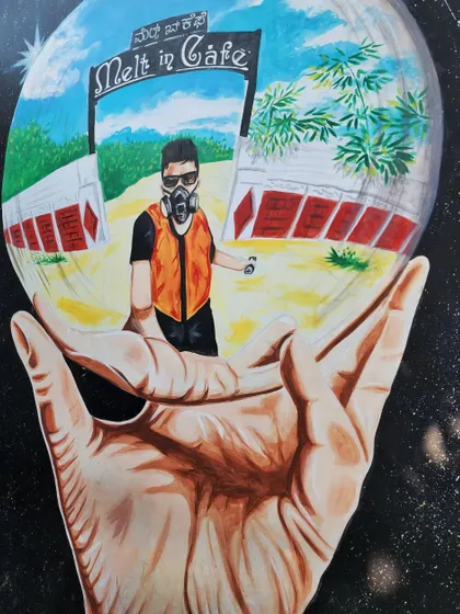 A detailed view of the signature mural, showing the reflection of the cafe's entrance in the sphere.
