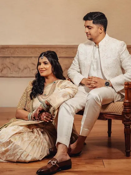 A modern and chic couple portrait. The bride's relaxed pose and beautiful soft glam makeup exude an effortless elegance.