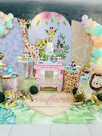 A whimsical take on the safari theme, using pastel colors and a pink jeep prop. This setup is perfect for a little girl's wild adventure party.