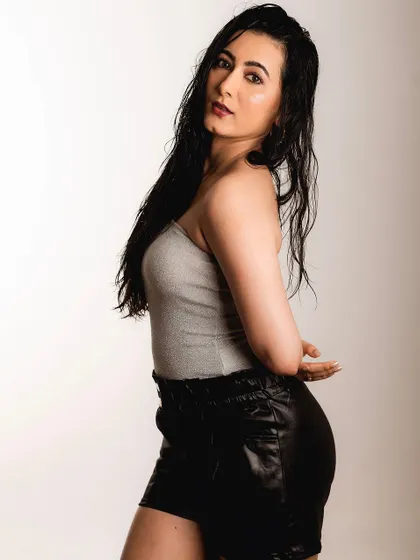 A similar pose from the same series, showing a slightly different angle. The focus remains on the quiet, confident mood.