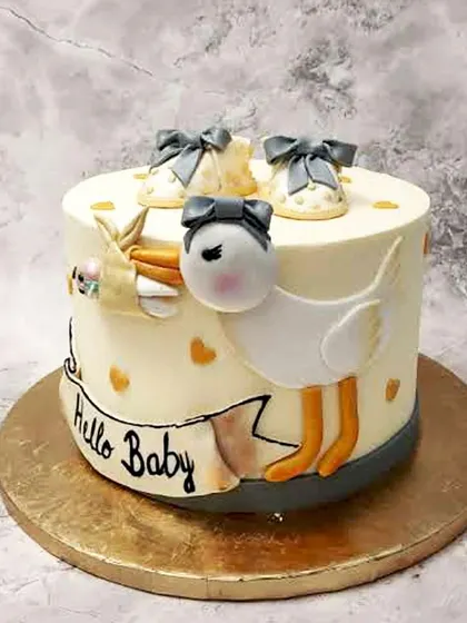 We deliver a special arrival with this "Hello Baby" stork cake. A sweet stork carries a precious bundle on the side of the cake, which is topped with adorable baby shoes, creating a classic and heartwarming baby shower theme.