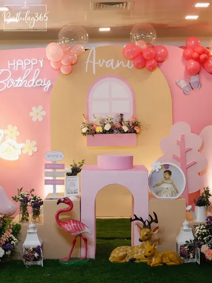 A beautiful fairy-themed setup for Avani's birthday, featuring a soft pink and yellow color scheme, glowing neon signs, and woodland creature props.