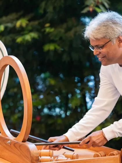 Guests enjoying a unique wooden carnival game. We can arrange for a variety of interactive entertainment options to keep guests of all ages engaged and having fun.