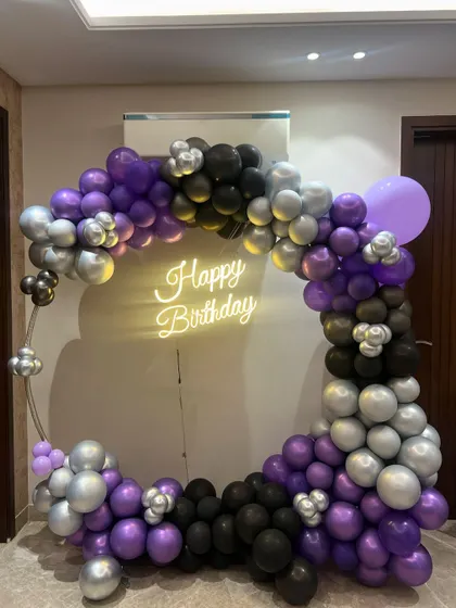 Another shot of the purple, black, and silver balloon arrangement, perfect for a sophisticated adult birthday party.