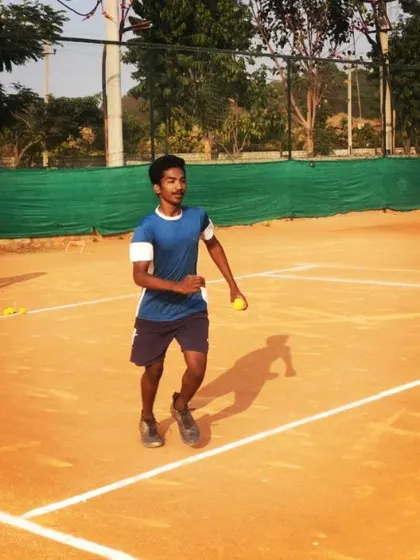 An intermediate player participates in a movement drill on the clay court. Progressing from basics involves integrating footwork with stroke production.