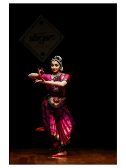 A graceful pose from a performance in Chennai, showcasing the elegant lines of the Thanjavur style.