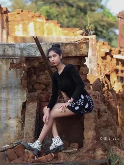 A wide shot showing the subject within the context of the rustic location, creating a strong sense of place.