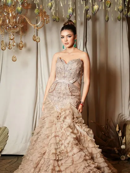 Our signature glam. This look features a dramatic winged liner, a high bun, and flawless skin, creating a diva-like effect perfect for a grand reception.