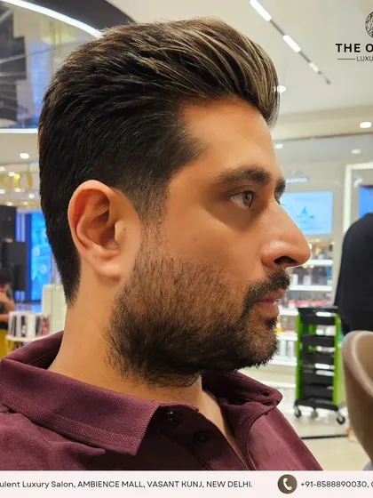 Precision cuts for the sharpest guys. This haircut features highlights for added texture and a voluminous, styled-back look.