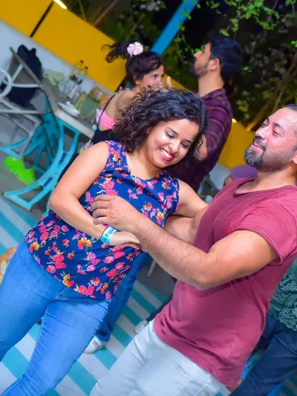 A close and connected dance with smiles all around.