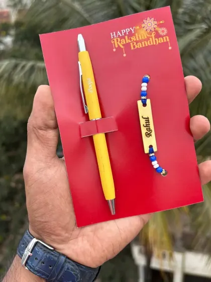 The turbo pen and rakhi combo, shown here with a bright yellow pen.