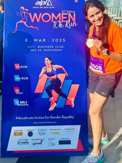 A proud finisher at the Women 10K Run. Every medal tells a story of hard work and dedication.