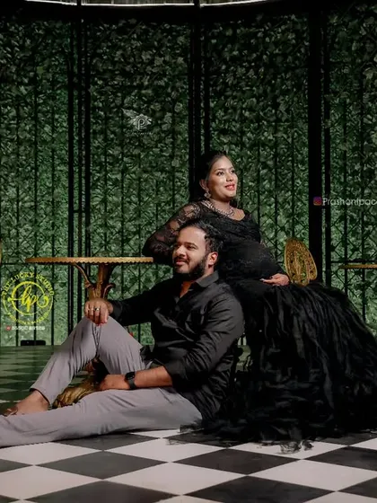 A dramatic and high-fashion maternity shoot. I styled the couple in black, with her in an intricate feathered gown, creating a unique and powerful image.