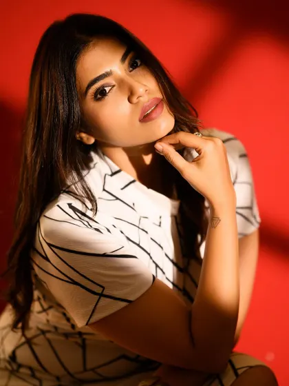 A seated portrait using the same lighting technique. The shadows create a dynamic composition that is both artistic and flattering.
