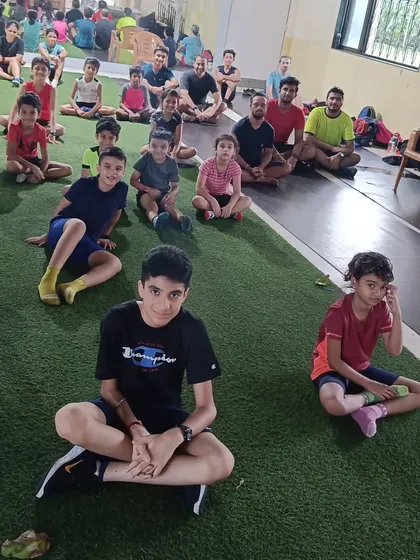 The team unwinding together after a post-workout session. Building a strong community is as important as building strong athletes.