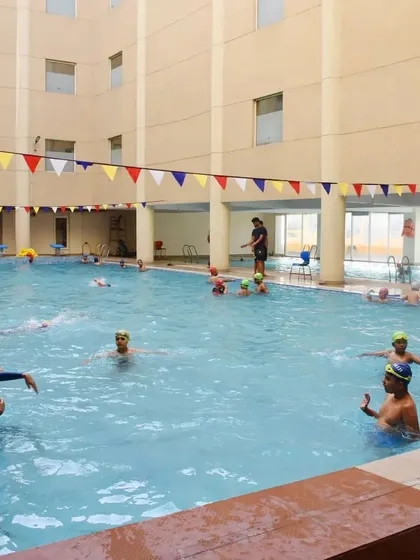 Our spacious pool allows multiple activities to happen at once. Here, kids learn and play under the supervision of my coaching staff.
