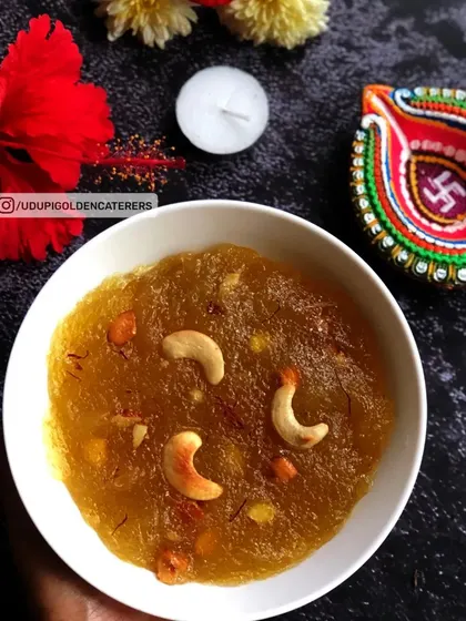 A festive bowl of Kasi Halwa, a traditional South Indian sweet made from ash gourd. Its rich texture and garnish of cashews make it a celebratory dessert.
