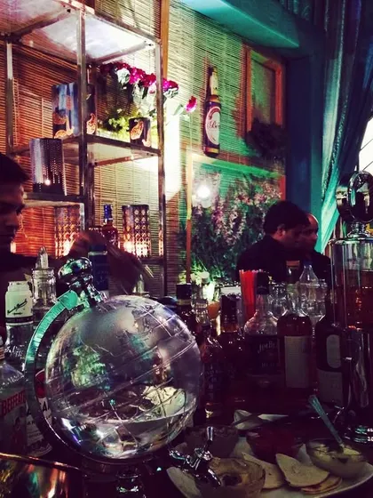 This is a molecular gastronomy bar in action. The setup includes specialized equipment like globes and infusers, allowing me to create truly scientific and innovative cocktails on-site.
